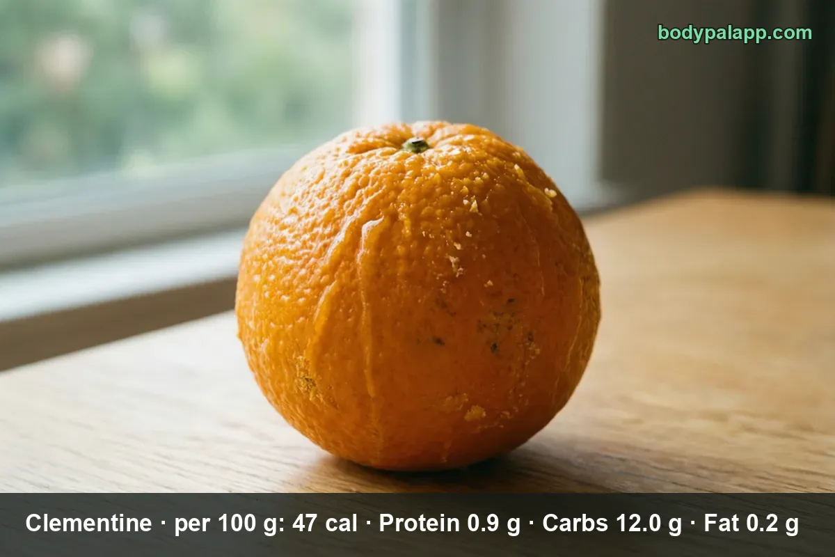 Close-up of one whole clementine on a wooden table beside a window.